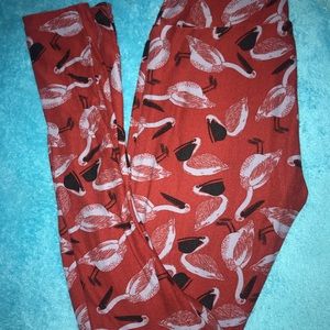 Dark red LulaRoe OS leggings with pelican prints